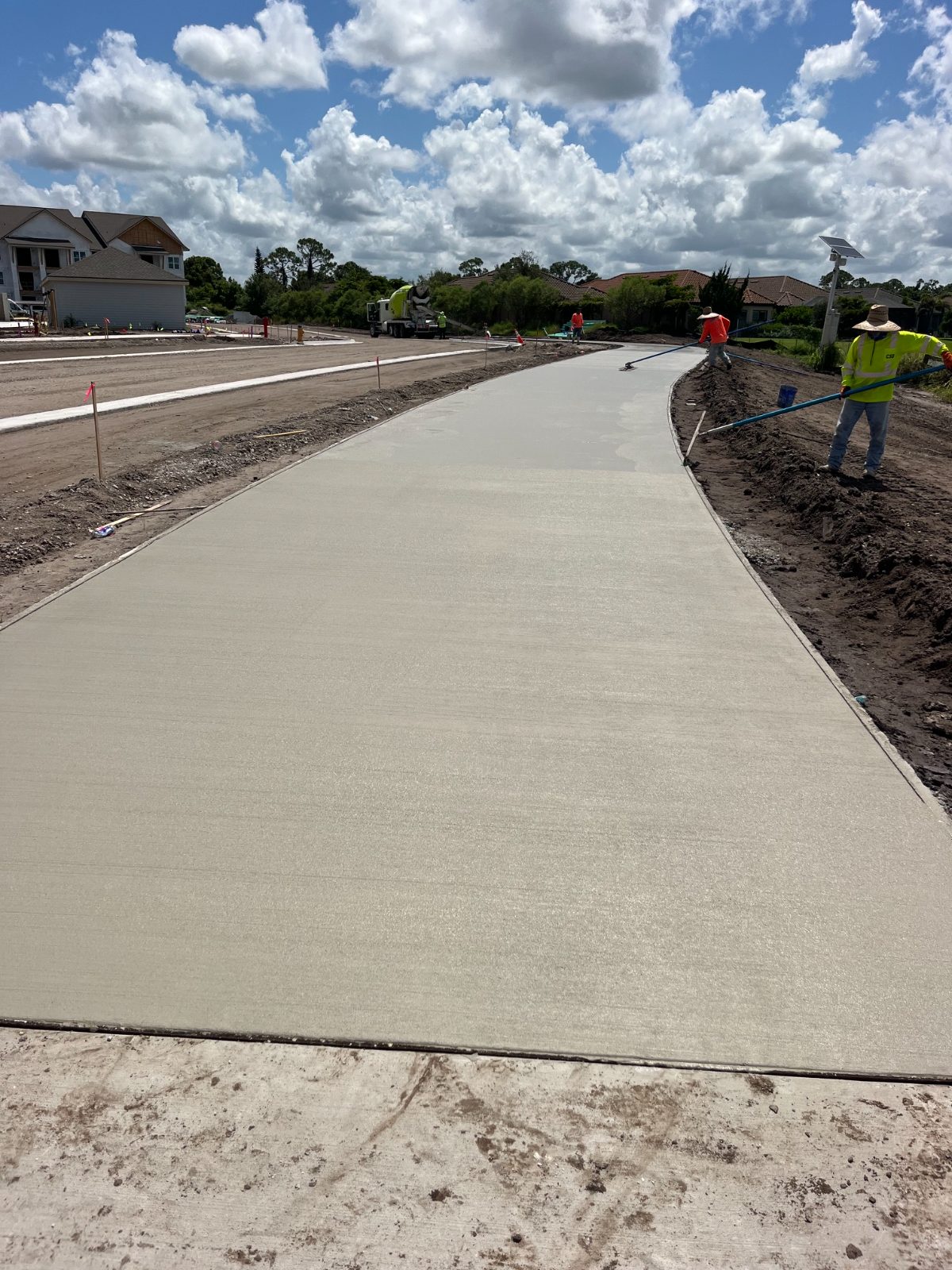 Wide ADA-compliant concrete sidewalk at a commercial building