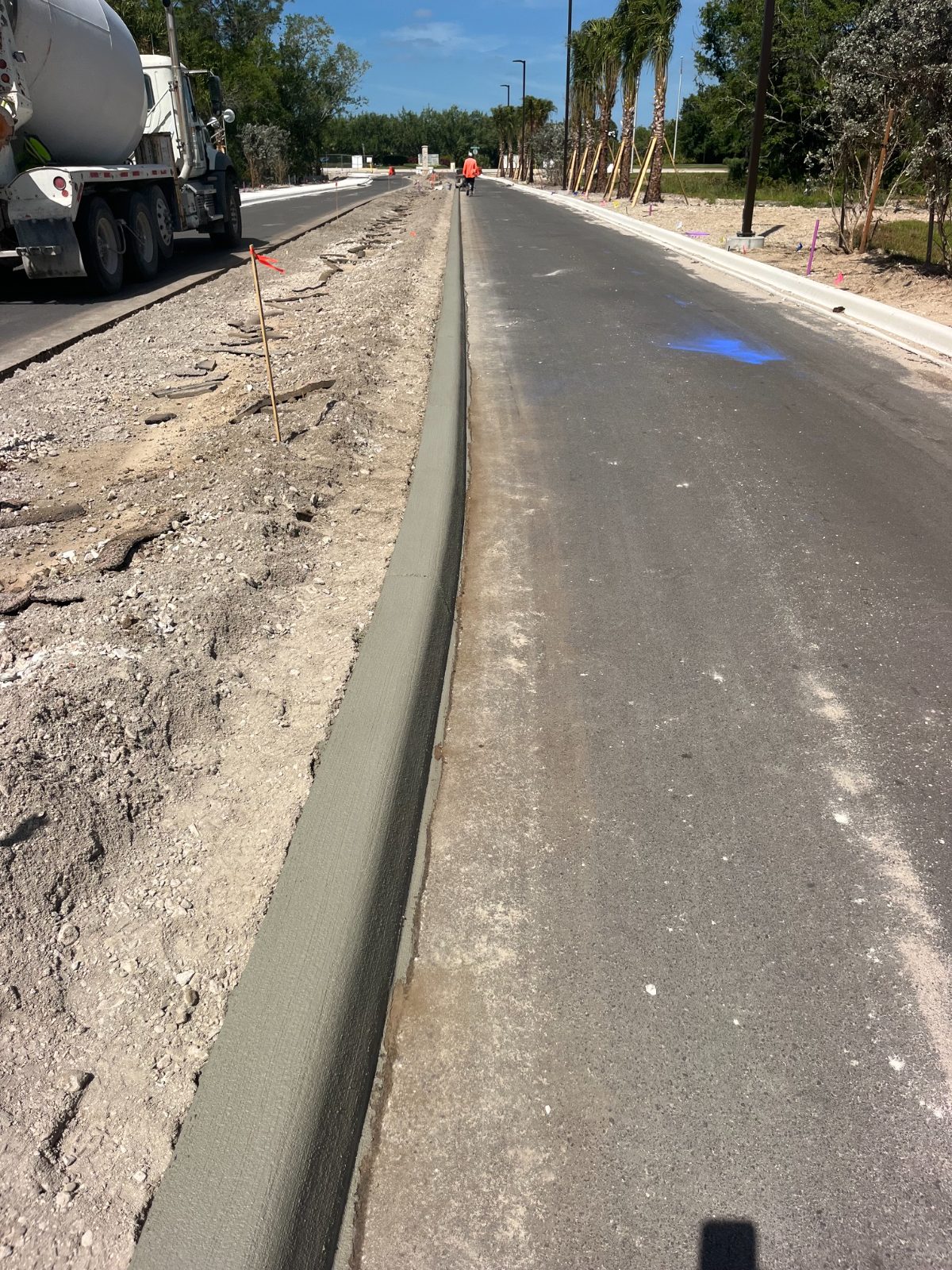 Machine-poured concrete curb and gutter along a new roadway near Bradenton, FL