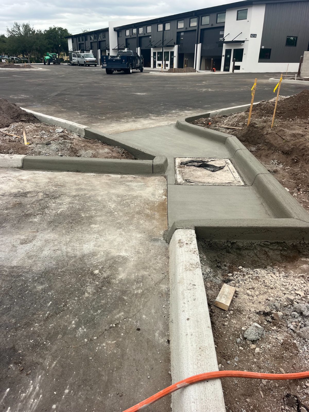 Hand-formed curb and ramp work at a commercial project in Sarasota